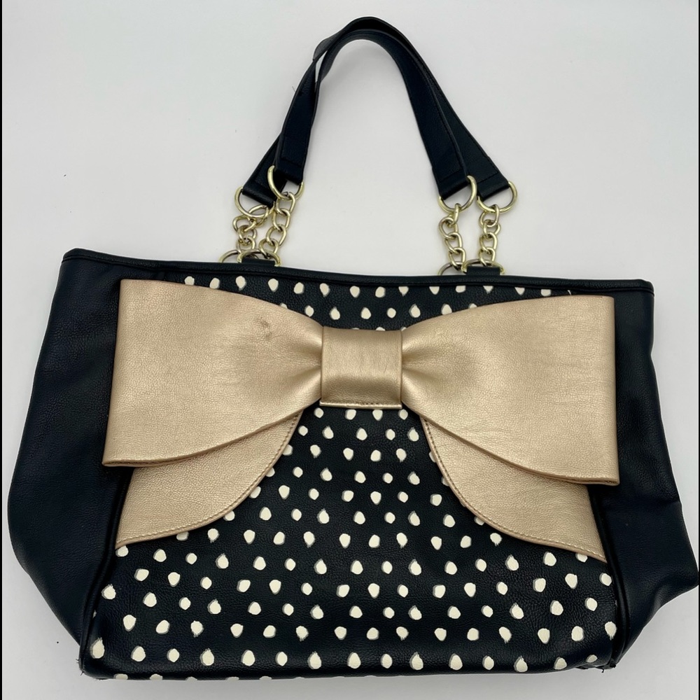 Used Betsey Johnson zipper tote. Black with white polka dots and gold bow